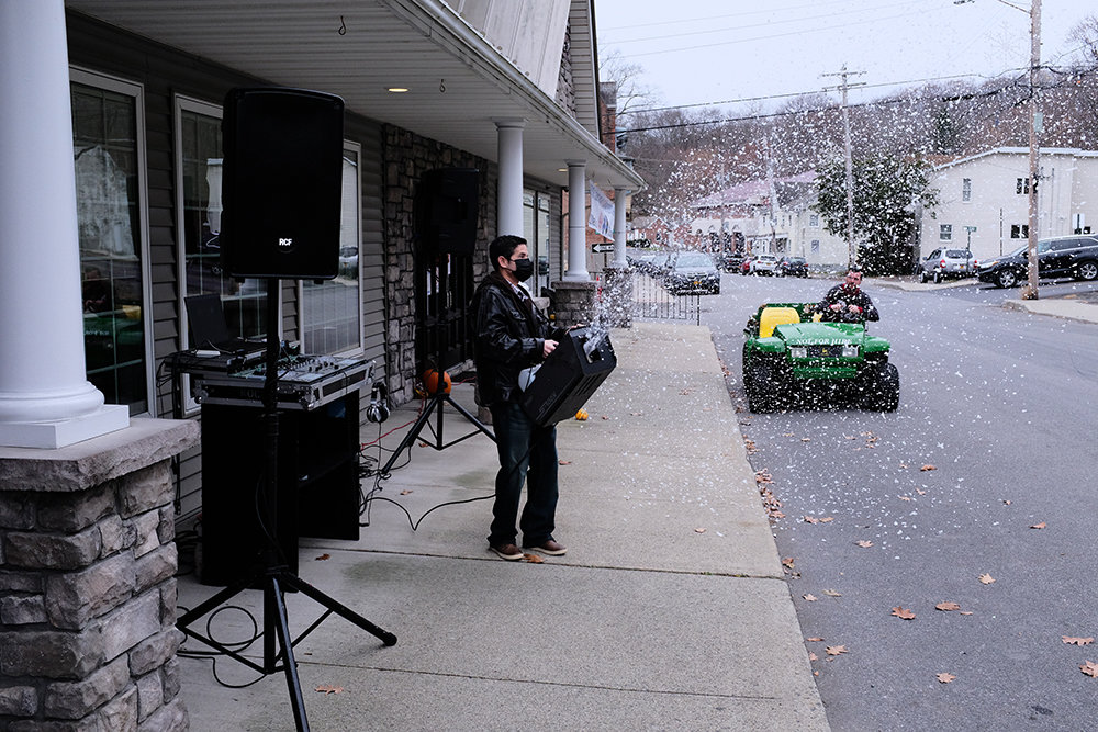 D.J. Erick Santana, of Right On Cue Productions, brought his sound equipment and a snow machine and the hamlet of Milton was decorated for the holiday season.